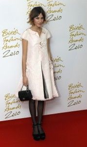 Model Alexa Chung poses for photographers as she arrives for the British Fashion Awards at the Savoy Theatre, in central London