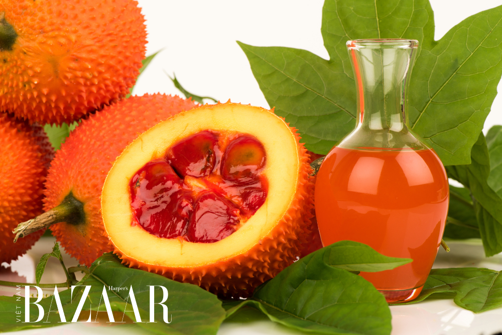 dầu gấc trị mụn và làm mờ vết thâm